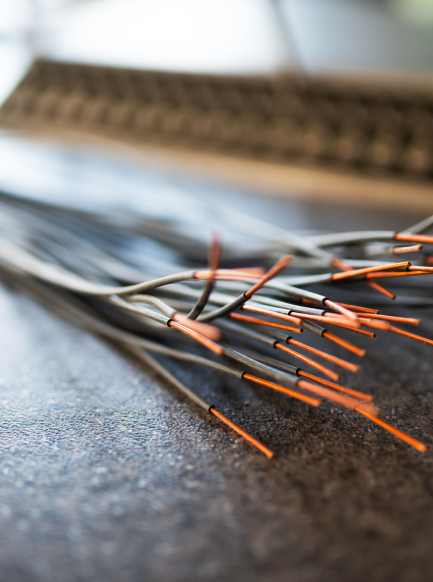 bundle-of-cut-thin-wires-with-red-connections